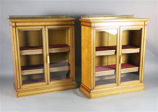 A pair of late Victorian Holland & Sons satinwood dwarf bookcases, W.3ft 3in. D.1ft 4in. H.4ft